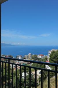 a view of the ocean from a balcony at Davids Apartments in Sarandë