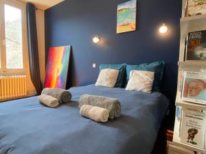 Ένα ή περισσότερα κρεβάτια σε δωμάτιο στο Bleu turquoise