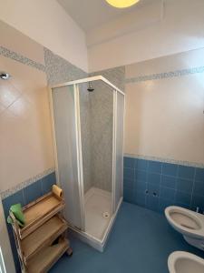 a bathroom with a shower and a toilet at Fantasy House 2.0 in Forio d'Ischia