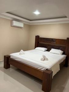 Katil atau katil-katil dalam bilik di Pousada da Luz 20v