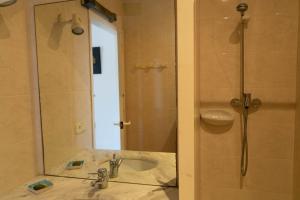 a bathroom with a sink and a shower with a mirror at Apartment 1st sea line in Sa Tuna, Begur H85 in Isla Negra +22 photos