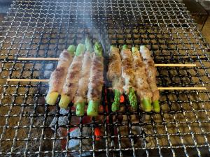 a bunch of food on top of a grill at Yuuzuru in Ito