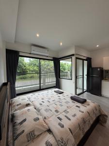 Ένα ή περισσότερα κρεβάτια σε δωμάτιο στο P One Apartments