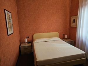 Posteľ alebo postele v izbe v ubytovaní Hotel Corona