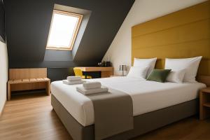 Voodi või voodid majutusasutuse Apex Apartman Sárvár toas