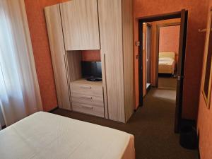 Posteľ alebo postele v izbe v ubytovaní Hotel Corona