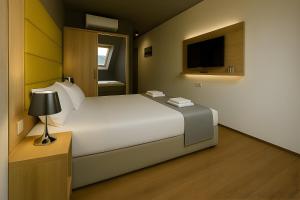 Voodi või voodid majutusasutuse Apex Apartman Sárvár toas