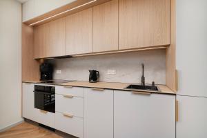 Η κουζίνα ή μικρή κουζίνα στο EASY RENT - Jasna Centrum Taras +25 φωτογραφίες