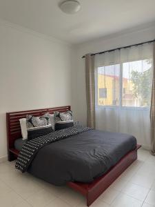 Tempat tidur dalam kamar di The Bacongo Gem