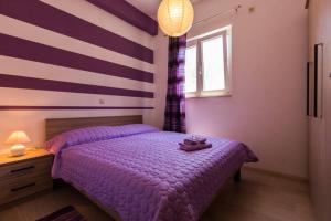 Postel nebo postele na pokoji v ubytování Apartments Nenich Aves