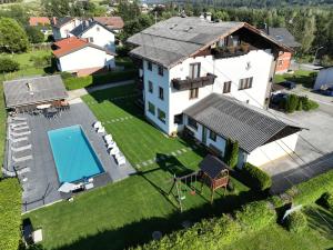 an aerial view of a house with a swimming pool at Keutschacherhof in Keutschach am See