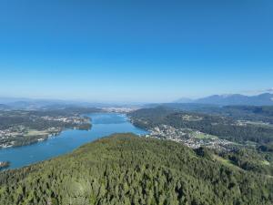 an aerial view of a river and a city at Keutschacherhof in Keutschach am See