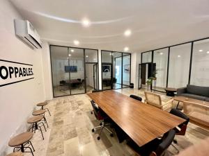 an office with a large wooden table and chairs at Always Playa at IPANA in Playa del Carmen +44 photos