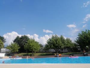a large swimming pool with people in the water at Tre metr sopra il cielo '' GiraSoli'' in Felitto