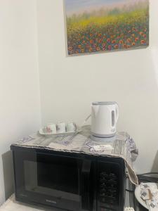 Príslušenstvo na prípravu kávy alebo čaju v ubytovaní Casa vacanza La Ninfea intera casa