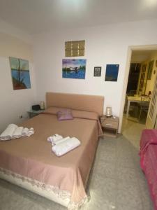 Posteľ alebo postele v izbe v ubytovaní Casa vacanza La Ninfea intera casa
