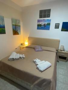 Posteľ alebo postele v izbe v ubytovaní Casa vacanza La Ninfea intera casa