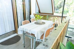 a white table and chairs on a porch at Casa Maria at Bigang Munti in San Juan +16 photos