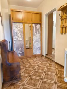 a living room with a tile floor at Apartament 2pokojowy ,pokoje in Lubkowo