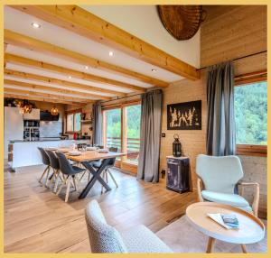a living room with a table and chairs at Le Sylvana I T4 I Abondance in Abondance