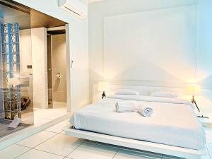 En eller flere senge i et værelse på Villa Blanca