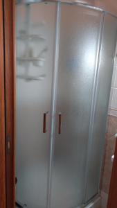 a white refrigerator freezer sitting in a kitchen at Casa Anna in Bosa