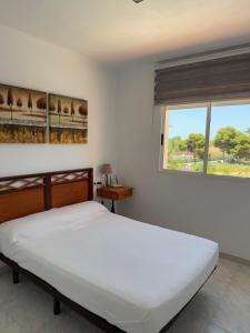 Katil atau katil-katil dalam bilik di Bolnuevo Apartment