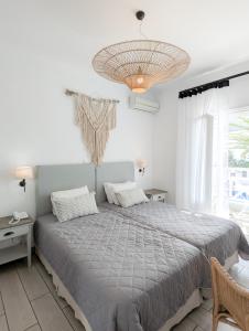 Кровать или кровати в номере Hotel Benois +37 фотографий