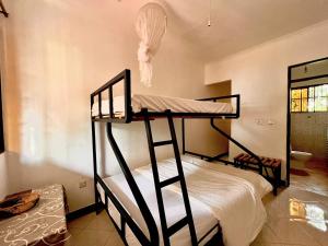 Ένα ή περισσότερα κρεβάτια σε δωμάτιο στο Acacia Tree Apartments