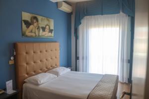Postel nebo postele na pokoji v ubytování Hotel Lory My Wellness SPA