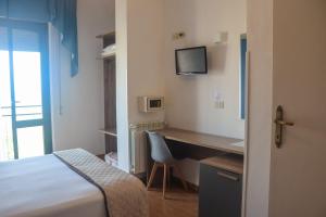 Postel nebo postele na pokoji v ubytování Hotel Lory My Wellness SPA