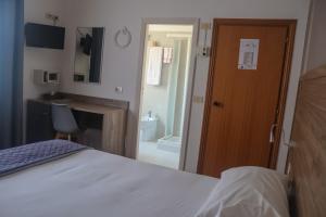 Postel nebo postele na pokoji v ubytování Hotel Lory My Wellness SPA