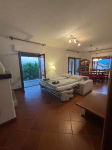 a large bedroom with a bed and a table at Casa Vacanza Anna in Verbania