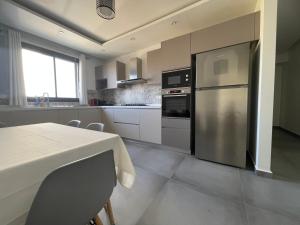 Kuchyň nebo kuchyňský kout v ubytování Alger - Hydra - Appartement moderne avec parking + 4 fotografie