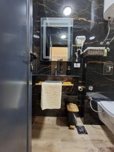 a bathroom with a sink and a mirror at Vhtwins apartment in Ulcinj +21 photos