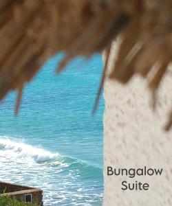 a view of the ocean from a building at Mandala Bungalows - Adults Only in Los Caños de Meca