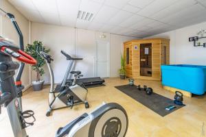 a fitness room with a gym with a treadmill at NOSTRA LIBERTAT - Piscine - Terrasse in Rivières