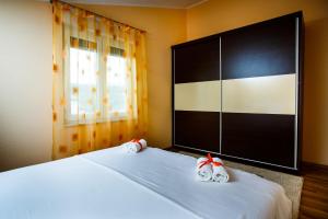 Postel nebo postele na pokoji v ubytování Rogoznica Apartments Kristina