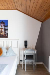 Postel nebo postele na pokoji v ubytování Gasthof Salurn