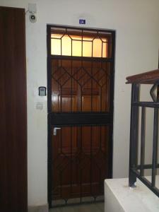 a door with stained glass in a room at Cozyblue fully furnished 1 bedroom bnb in Mombasa