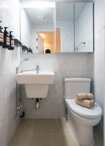 a bathroom with a toilet and a sink and a mirror at 반포레스트 room3 in Seoul