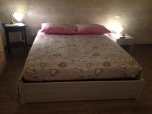 Voodi või voodid majutusasutuse Le due arcate toas