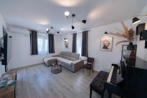a living room with a couch and a table at Villa Goranovic in Herceg-Novi +36 photos