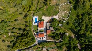 an aerial view of a house in the forest at Villa Goranovic in Herceg-Novi