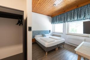Postel nebo postele na pokoji v ubytování Gasthof Salurn