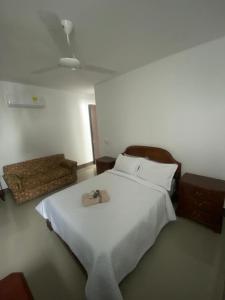 a bedroom with a bed with a purse on it at Oceanfront Luxury - A pasos del Centro Histórico in Cartagena de Indias +45 photos