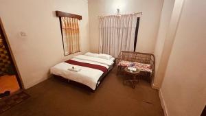 Voodi või voodid majutusasutuse Cherry Garden Pokhara toas