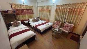Voodi või voodid majutusasutuse Cherry Garden Pokhara toas