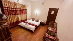 Voodi või voodid majutusasutuse Cherry Garden Pokhara toas