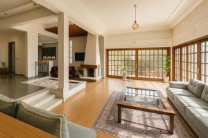 a living room with a couch and a table at Spacious villa in Founty, beach side 40m front Sofitel in Agadir